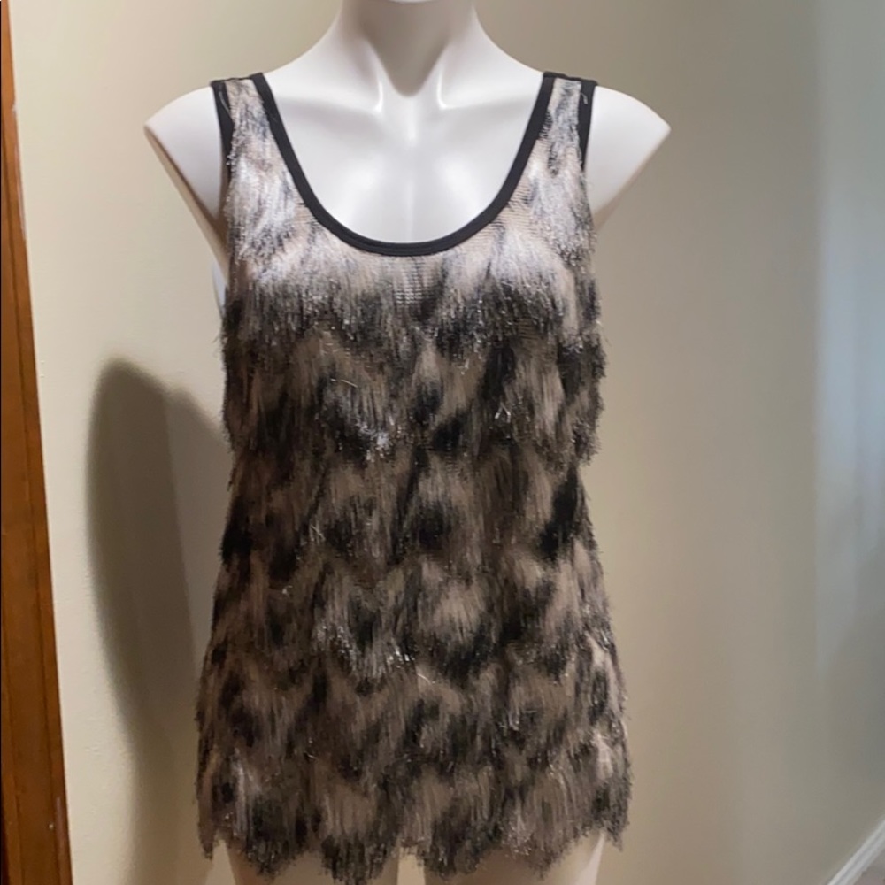 Be the hit of the party with this FUN top.